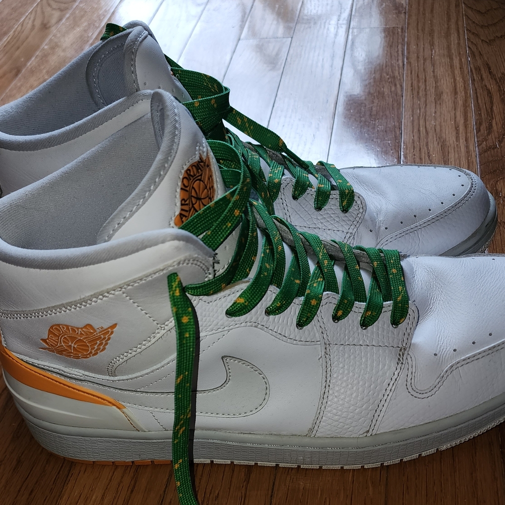 Air Jordan 1 Retro '86 model in the White Kumquat MIAMI HURRICANES 2014